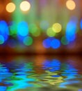 Street lights bokeh background reflection in water Royalty Free Stock Photo