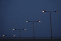 Clear sky and street lights in a row Royalty Free Stock Photo