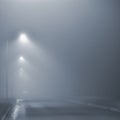 Street lights, foggy misty night, lamp post lanterns, deserted road in mist fog, wet asphalt tarmac, car headlights approaching Royalty Free Stock Photo