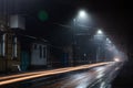 Street lights foggy misty night. Tram route on a city street