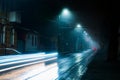 Street lights foggy misty night. Tram route on a city street