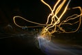 Street lights in speeding car in night time, light motion with slow speed shutter view from inside front of car. Royalty Free Stock Photo