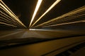 Street lights in speeding car in night time, light motion with slow speed shutter view from inside front of car. Royalty Free Stock Photo