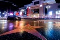 The street, the luxury cars pass. Hollywood