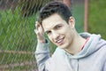 Street man close to fence Royalty Free Stock Photo