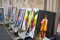 Street market with colorful paintings for sale lying on the floor