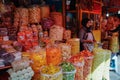 A street market and a female seller selling local chips
