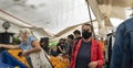 Street market with women shopping and wearing medical protective face masks