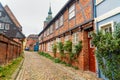 Street with Medieval old brick buildings. Luneburg. Germany