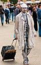 Street mime performer arriving at work in Krakow,