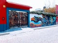 Street mural in san miguel allende next to eclectic door. Colorful tribal art mural