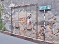 Street Mural title `Brother and Sister on a Swing` Royalty Free Stock Photo