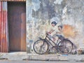 Street Mural title `Kids on a Bicycle`