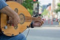Street musician busking in the city for money