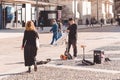 Street musician Gianni Guaglio is going to play the theremin near Duomo cathedral. Milan city during coronavirus on