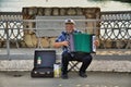 Street musician - harmonist Royalty Free Stock Photo