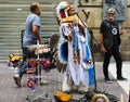 Santiago, Chile, a Street musician in the costume of native american.