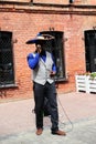 Street musician performs on the sidewalk