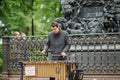 Street musician playing the chromatic glockenspiel metallophone near the monument to Krylov. Saint Petersburg, Russia Royalty Free Stock Photo