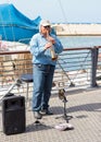 Street musician playing the clarinet on the waterfront in Yafo Royalty Free Stock Photo