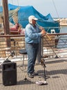 Street musician playing the clarinet on the waterfront in Yafo Royalty Free Stock Photo