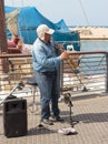 Street musician playing the clarinet on the waterfront in Yafo Royalty Free Stock Photo