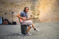 Street musician playing his guitar on the street in Rome Royalty Free Stock Photo