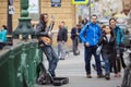 Street musician playing on the Italian bridge. Saint Petersburg, Russia. Royalty Free Stock Photo