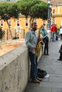 Street musician playing the saxophone in Rome, Italy Royalty Free Stock Photo