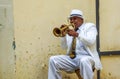 Street musician playing trumpet on the street of Havana, Cuba