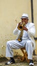 Street musician playing trumpet on the street of Havana, Cuba