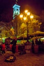 Street musician playing violin at night on the Rynok square in Lviv, Ukraine Royalty Free Stock Photo