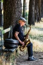 Street musician plays the saxophone on the embankment of the river Seine. Paris, France Royalty Free Stock Photo