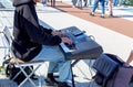 Street musician plays the synthesizer, someone& x27;s hand throws money Royalty Free Stock Photo