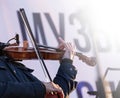 street musician violin plays music outdoors Royalty Free Stock Photo