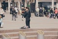 Street musician violinist girl plays violin in city square