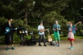 Street musicians band performing in a park Royalty Free Stock Photo