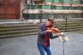 Street musicians entertaining tourists near landmark Florence attraction