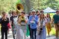 Street musicians. Playing on hub, on saxophone, on trombone and drum Royalty Free Stock Photo