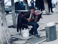 man playing accordeon in the street