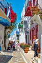 Street in Mykonos town with walking people Royalty Free Stock Photo