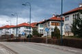 Street near road with nice white houses Royalty Free Stock Photo