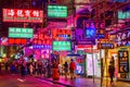Street at night with illuminated advertisings in Hong Kong