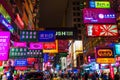 Street at night with illuminated advertisings in Hong Kong