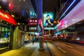 Street at night with illuminated advertisings in Hong Kong