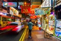 Street at night with illuminated advertisings in Hong Kong