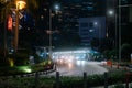 Street at night with many cars with lights from cars in Jakarta Indonesia
