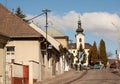 Street in Nova Bana town with clock tower