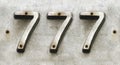 Street number iron sign with number 777