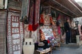 Street of the old city with traditional Azerbaijani carpets on the wall and the seller